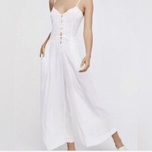 Free people white jumpsuit. Lace and button detail. Size 0